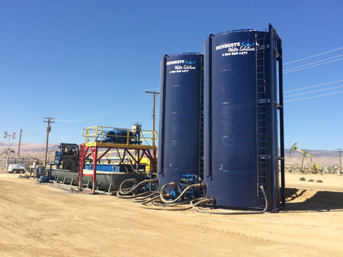 Upright liquid storage tanks.